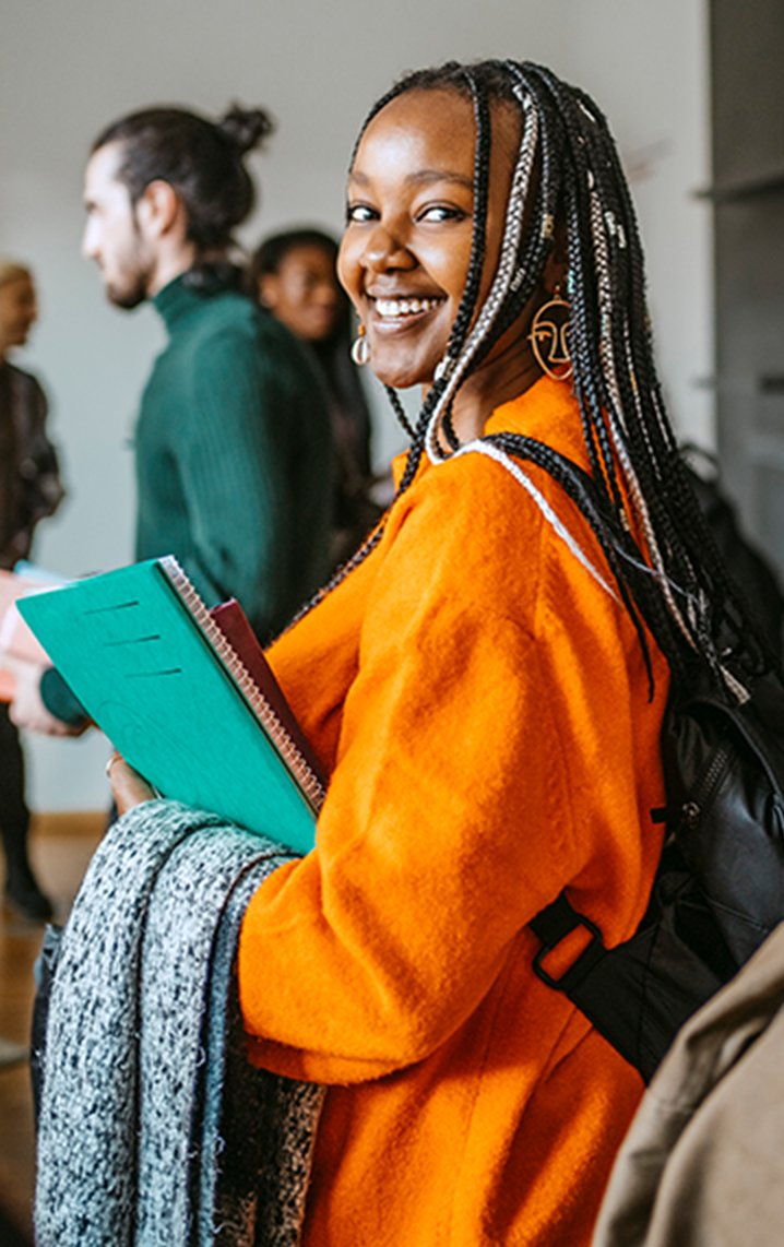 Female student holding textbook